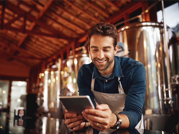 Brewery man on mobile device  