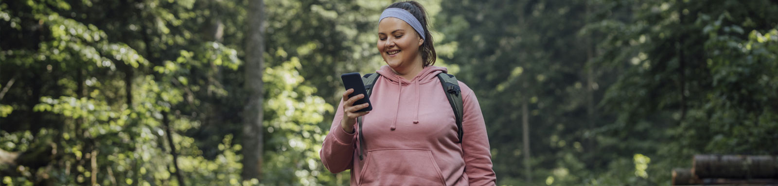 woman walking outdoors with phone
