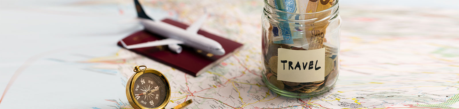 travel money plane compass map